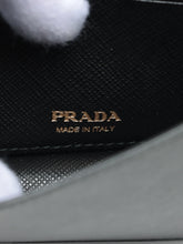 Load image into Gallery viewer, Black leather wallet on chain with gold-toned detailing Cross-body bags Prada 
